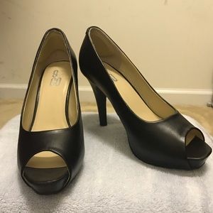 Black leather pumps